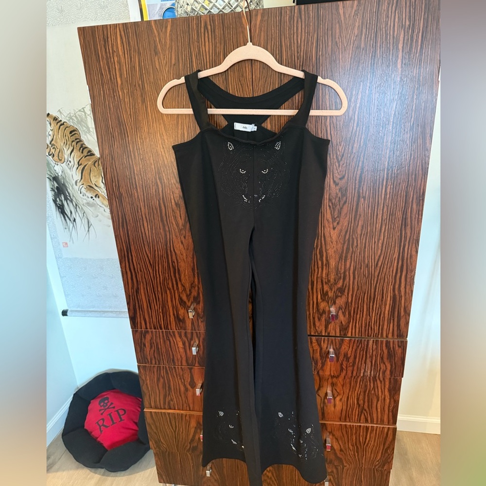 Black Women's cutout pants with tiger embellishment